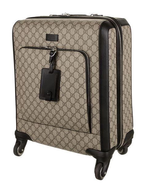 gucci supreme carry on suitcase